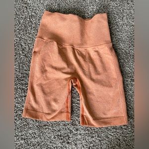 Orange butt scrunch biker shorts